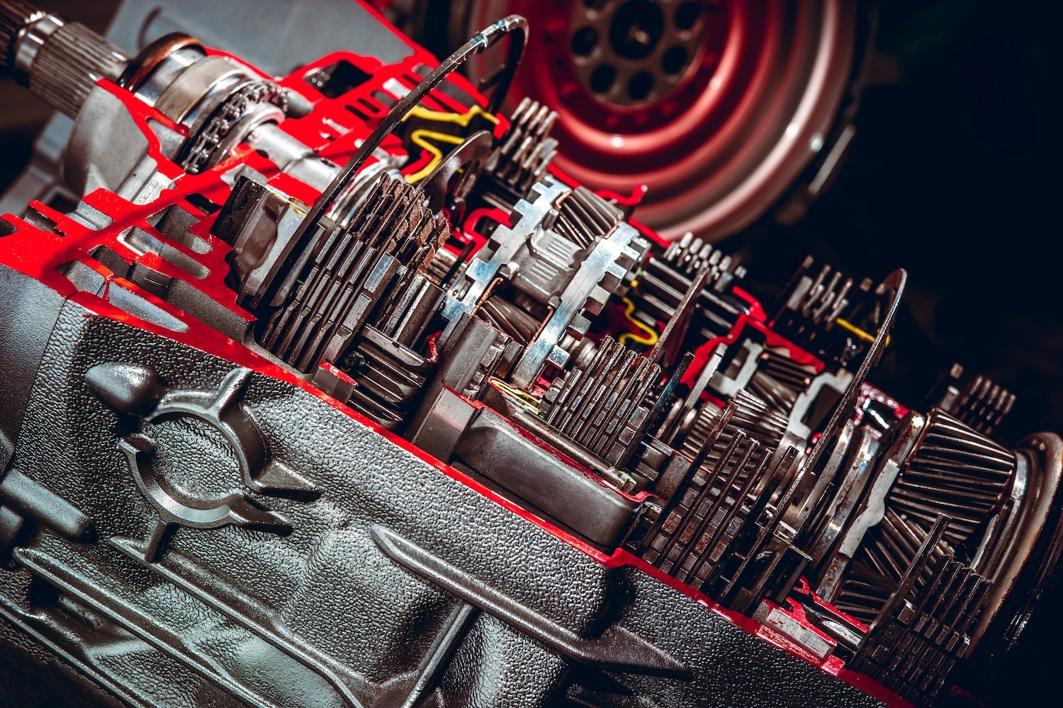 Parts from a vehicle gearbox. Shallow depth of field with the nearest gear in focus.