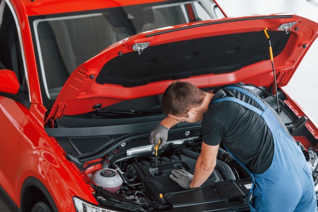 mechanic repairs automobile.