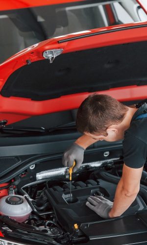 mechanic repairs automobile.